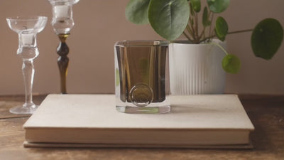Step-by-step guide to refilling your ENYALYË vessel; warming in a bain-marie, removing the old wax, and inserting a fresh candle refill.